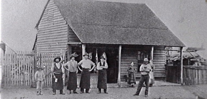 Wilson's Butcher Shop was originally a weatherboard building constructed by cooper turned butcher Daniel Fowler. The girl on the crutches is Nell Chinooks. Photo courtesy Campbelltown and Airds Historical Society.