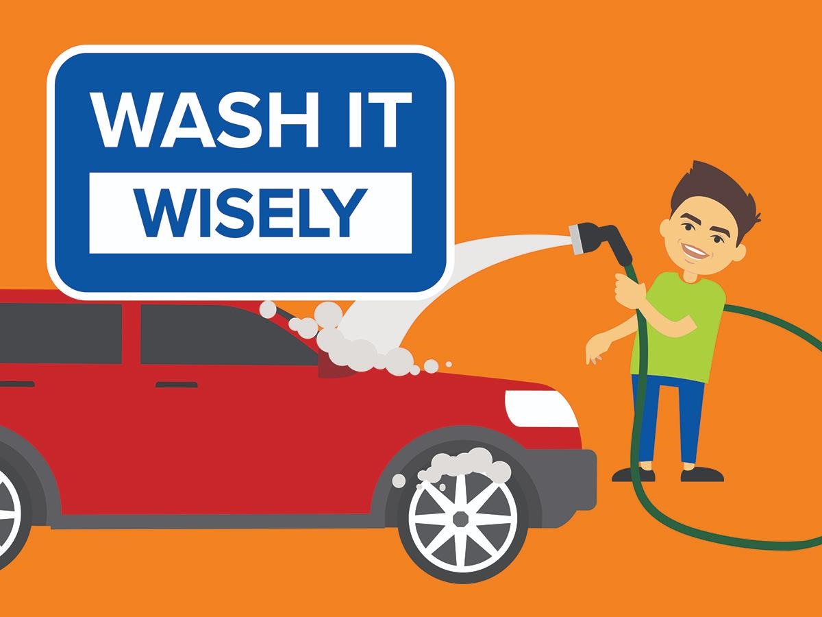 Image of a male wearing a green tshirt and blue pants and holding a hose to wash a red car with the slogan Wash It Wisely above the car