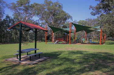 Kids will love spending time at the playground will parents can watch from the shade under a picnic table
