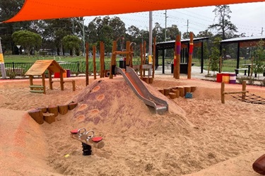 Sand play with climbing mound and slide