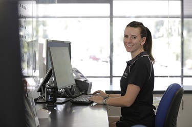 Staff member at front counter