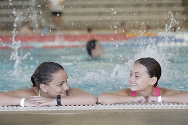 Two girls playing in the pool