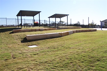 Shaded hut, outdoor fitness area and seating