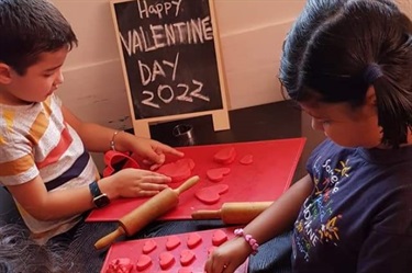 Children making playdough hearts on Valentine's Day