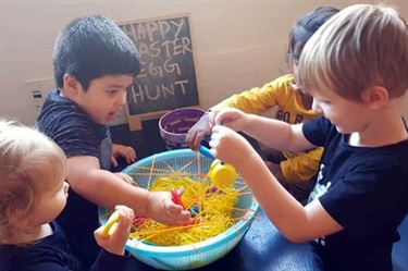 Children finding eggs on an Easter egg hunt