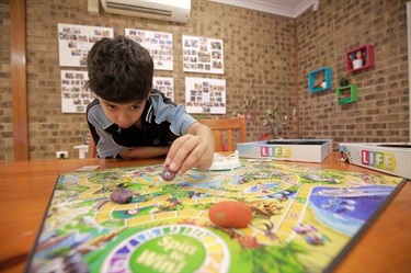 Boy enjoying a board game