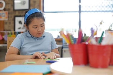 Girl doing an after school craft