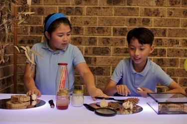 Two children doing indoor activity