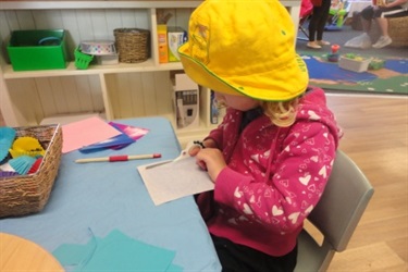 Child in a yellow hat