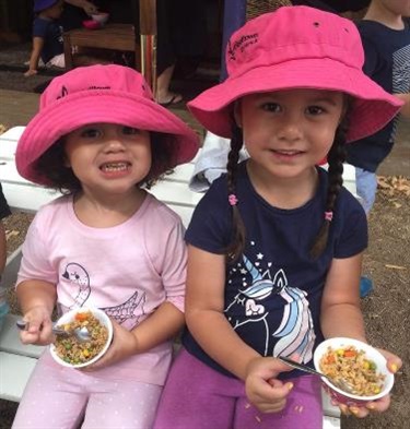 Two girls enjoying their lunch