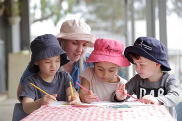 Three Children with Educator