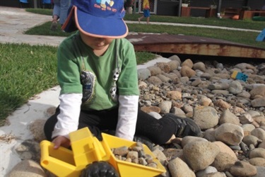 Child playing with trucks