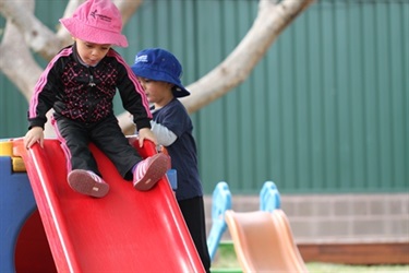 Child on slippery dip