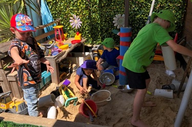 Children playing in the sand pit