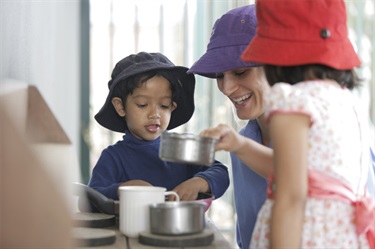 Kids playing with educator
