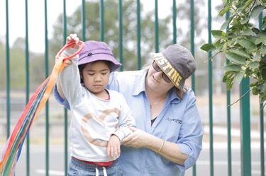 Educator assisting child