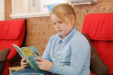 Child reading a book