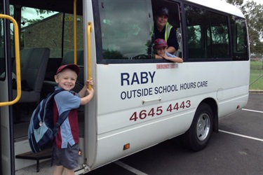 Children and educator on Raby OSHC bus