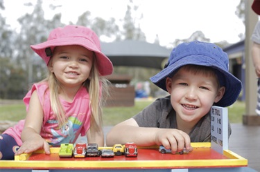 Kids playing with cars