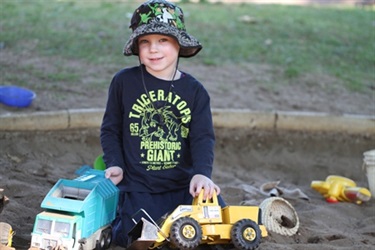 Boy playing with trucks