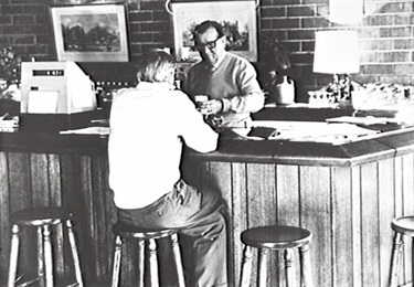 Guy Marsden serves a beer at the club bar in 1969.