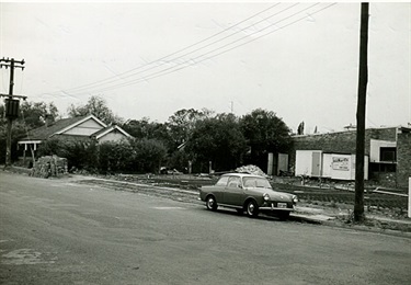 Former site of Tripp’s Garage, taken in 1969. The house behind was owned by the Tripp family.