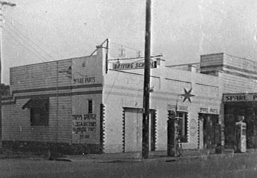 Tripp's garage as it stood in 1940. In the twenties crowds were known to gather outside to hear radio which was in its infancy.