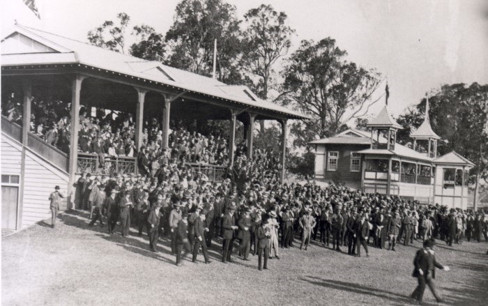 Crowds in the stands watching a race 