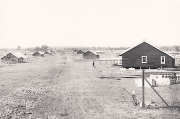 Farm land with small cottages scattered across it 