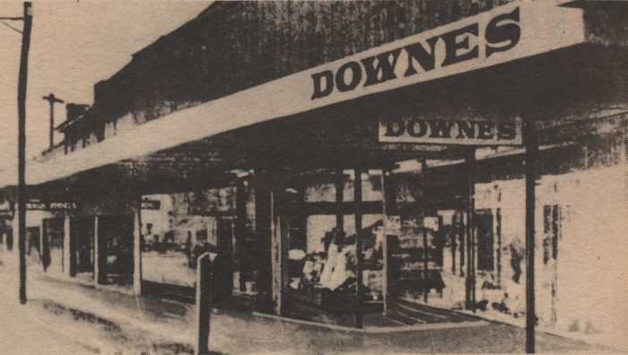 A newspaper clipping of the front view of Downes Department store