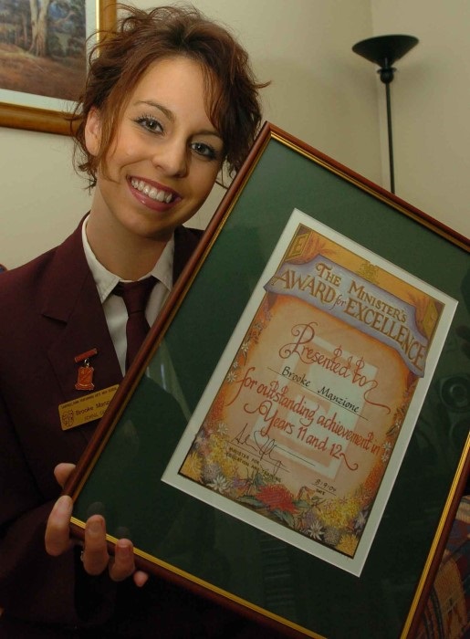Brooke Manzione as a student with her Minister's Award
