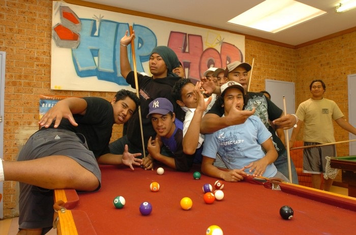 Youths playing Pool 
