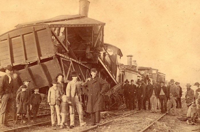 Old photograph of the scene at the 1884 Train Crash including the damaged train