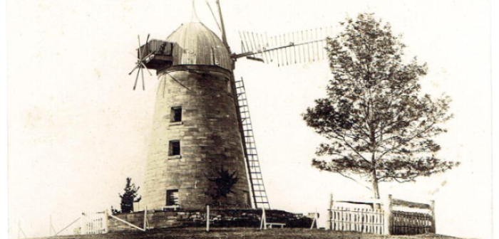 Black and white photograph of the covict built Windmill sitting on top of Mount Gilead hill