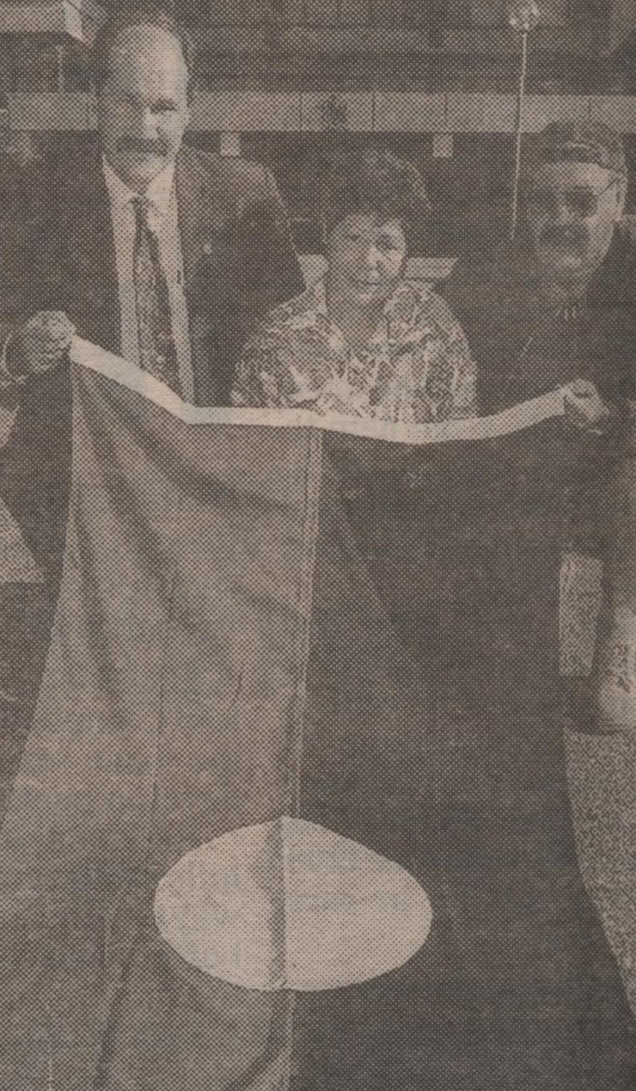 Locals holding an Aboriginal flag