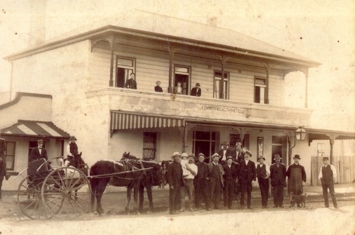 The Commonwealth Hotel with patrons standing outside