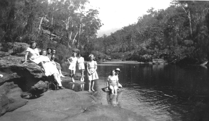 A group of young people swimming in the Georges River 