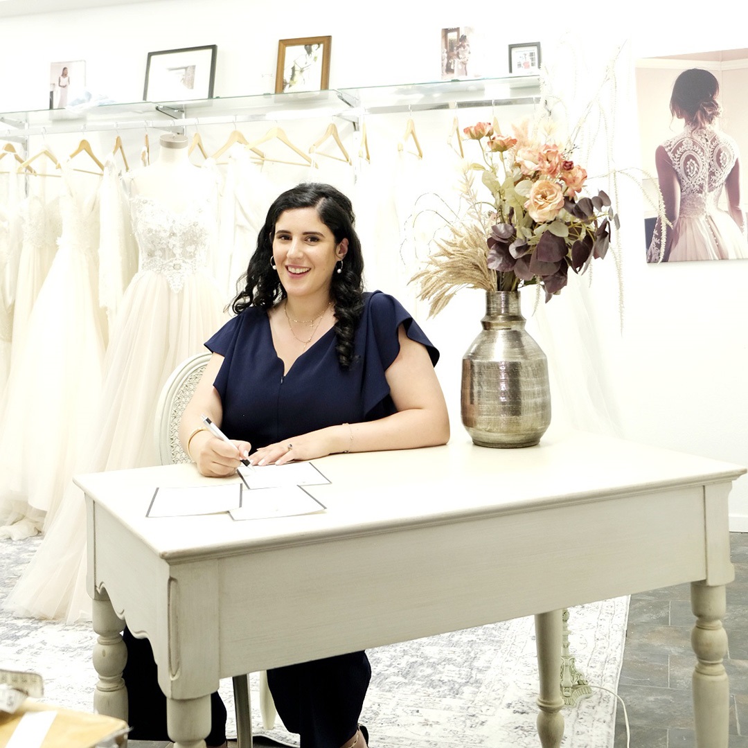 Fashion designer Ruth Fattal, sitting at a table
