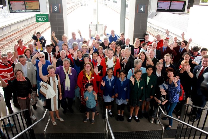 Crowd gathering at the Train station with Campbelltown Mayor 