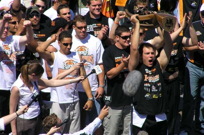 John Skandalis holding up the Trophy