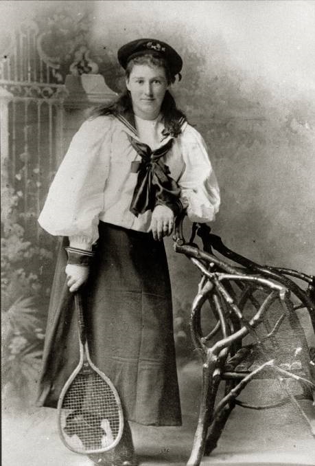 A black and white potrait of Rose Payten holding a tennis racquet