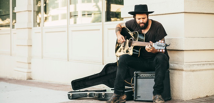 a busker playing a musical instrument