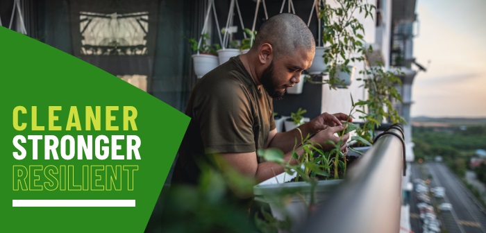 Person gardening on apartment balcony