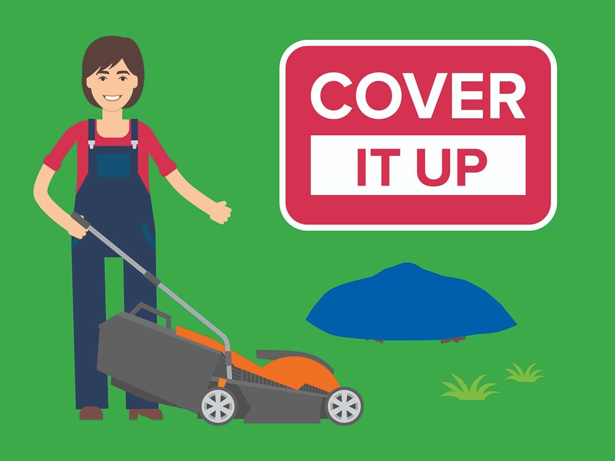 Image showing a woman wearing a red tshirt and blue overalls standing next to a lawnmower and a pile of leaves covered with a blue cover and a slogan above which reads Cover It Up