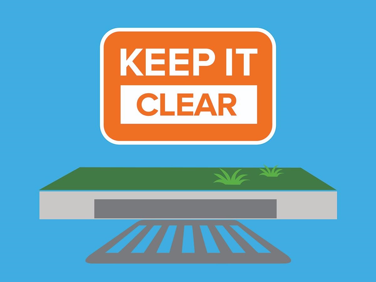 Image showing a section of kerb with a storm water drain and grate and the slogan Keep It Clear above the drain