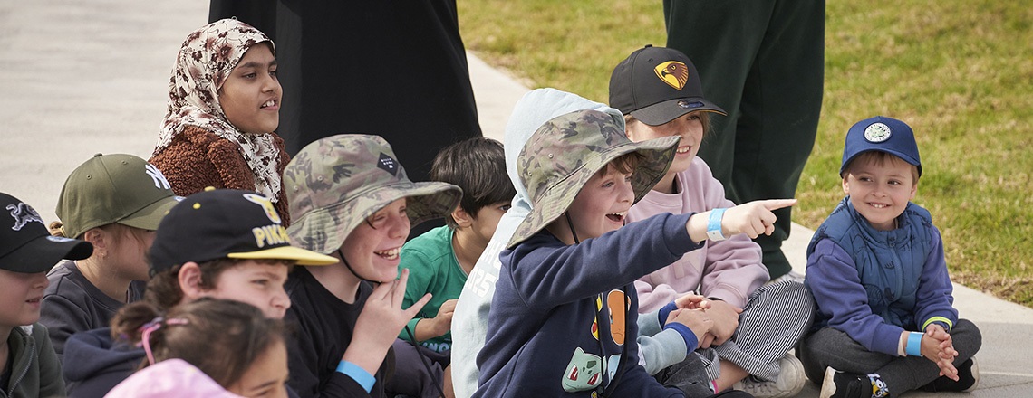 Children watching a show at the Billabong Parklands