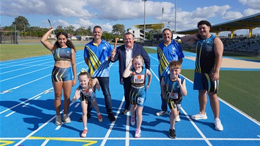 Mayor Darcy Lound with members of the Campbelltown Collegians Athletics Club