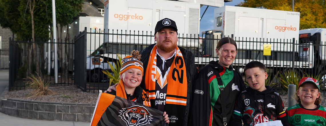 A family of Wests Tigers and South Sydney Rabbitohs supporters at Campbelltown Sports Stadium