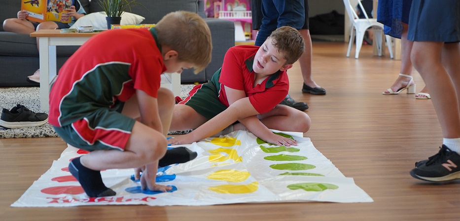 School kids playing twister