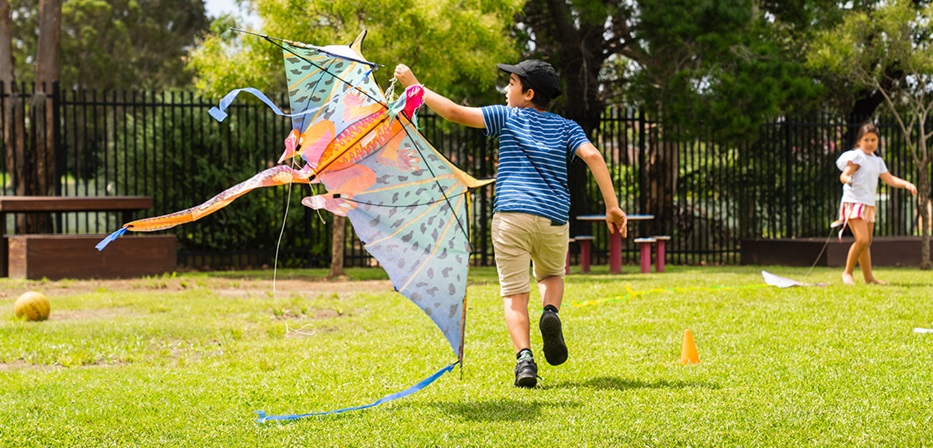 Child running with kite